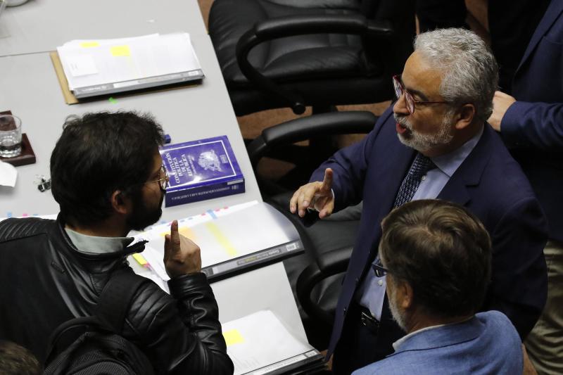 El entonces diputado Gabriel Boric y Luis Hermosilla en 2019