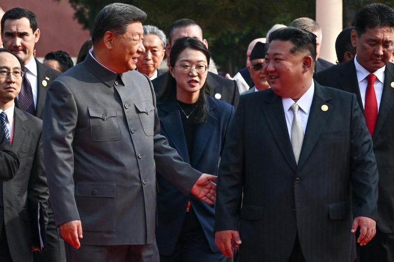 AFP - Xi Jinping y Kim-Jong-Un
