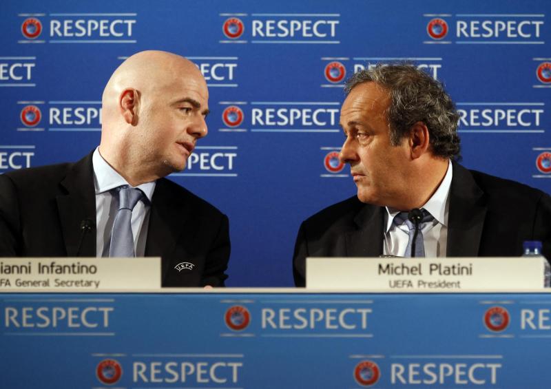 Infantino y Platini en 2015 - AFP