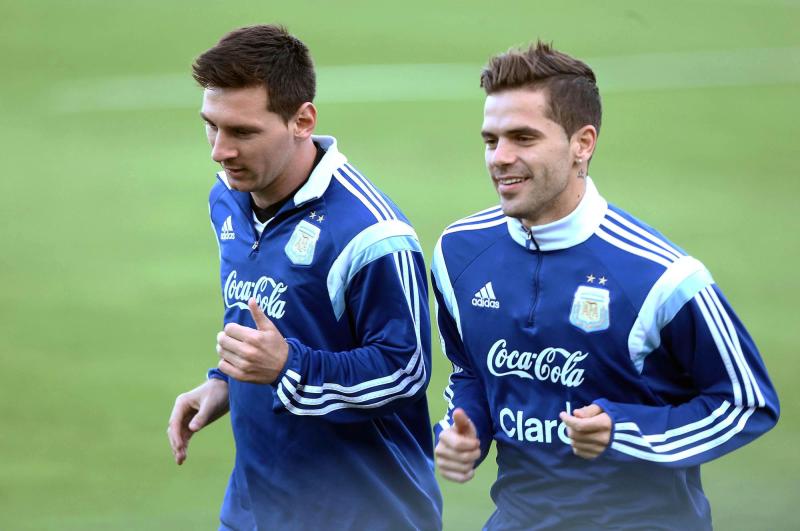Messi y Fernando Gago en 2014 - Agencia Uno