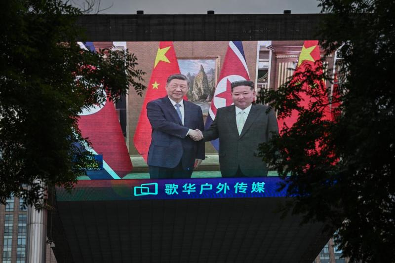 AFP - Xi Jinping y Kim-Jong-Un