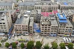 Decenas de personas atrapadas y desaparecidas en derrumbe de edificio en China Decenas de personas atrapadas y desaparecidas en derrumbe de edificio en China