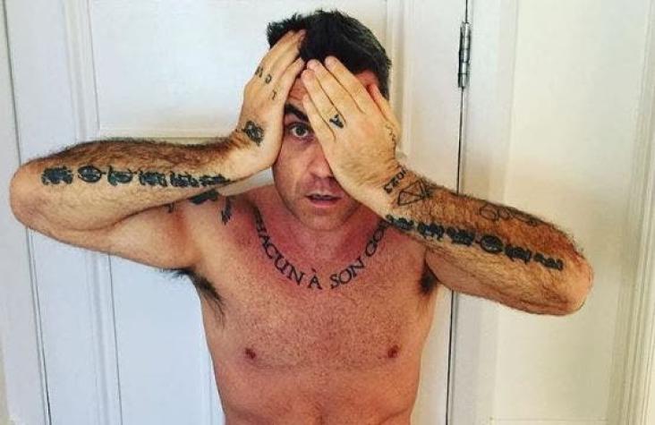 Robbie Williams se vuelve a destapar: posa desnudo para portada de revista