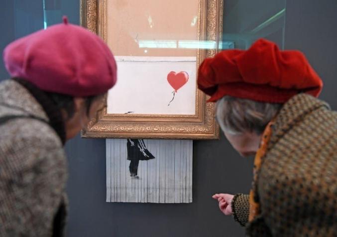 [FOTOS] El lienzo autodestruido de Banksy se expone en Alemania