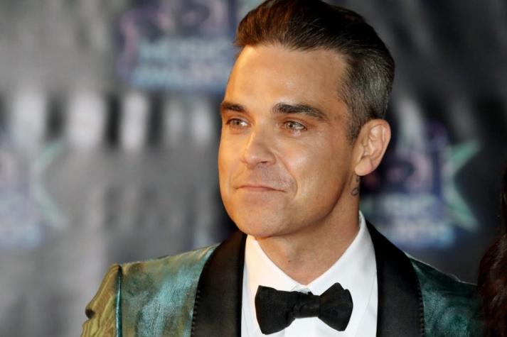 Robbie Williams instaló "seguridad las 24 horas" en su casa por temor a los extraterrestres