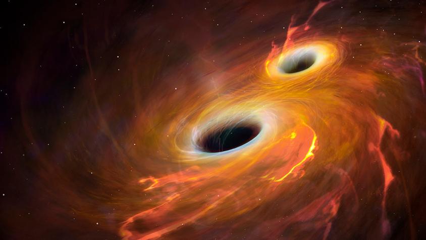 Choque de dos agujeros negros se podría sentir en nuestro planeta
