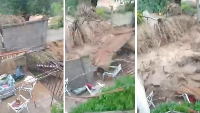 El impactante momento en que agua destruye muro en Limache y entra a patio de casa