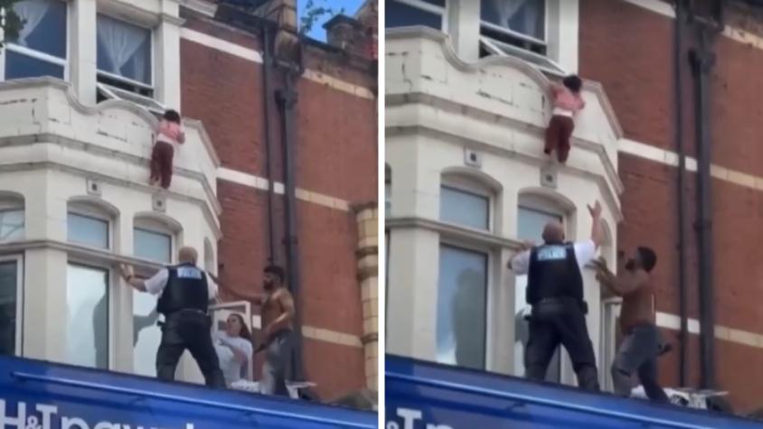 VIDEO | El heroico rescate a niña que estuvo colgando 9 minutos de una ventana en edificio de Londres